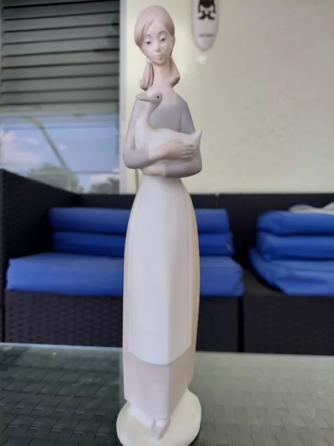 NAO by Lladro Girl A Holding Duck Figure 10.75 in tall