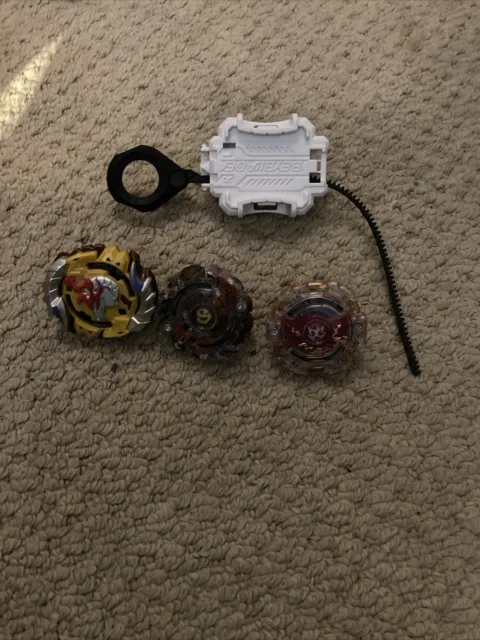 3 BEYBLADE Burst Tops With Launcher