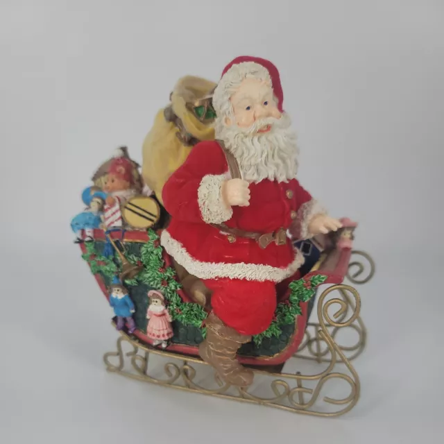 Santa Figurine With Presents on a Sleigh Resin Metal Flocked Coat and Bag