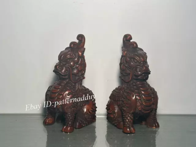 A Pair of Antique Wood Carved and Handcrafted Auspicious Qilin Statues