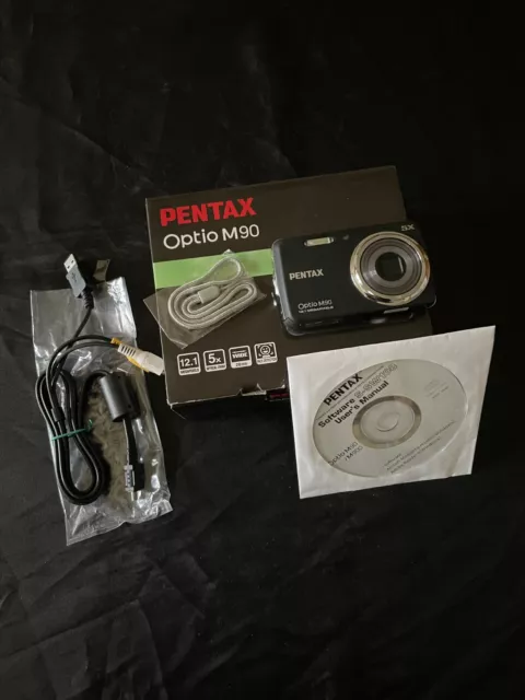 Appareil photo numérique PENTAX OPTIO M90 avec boîte et accessoires. Fonctionne