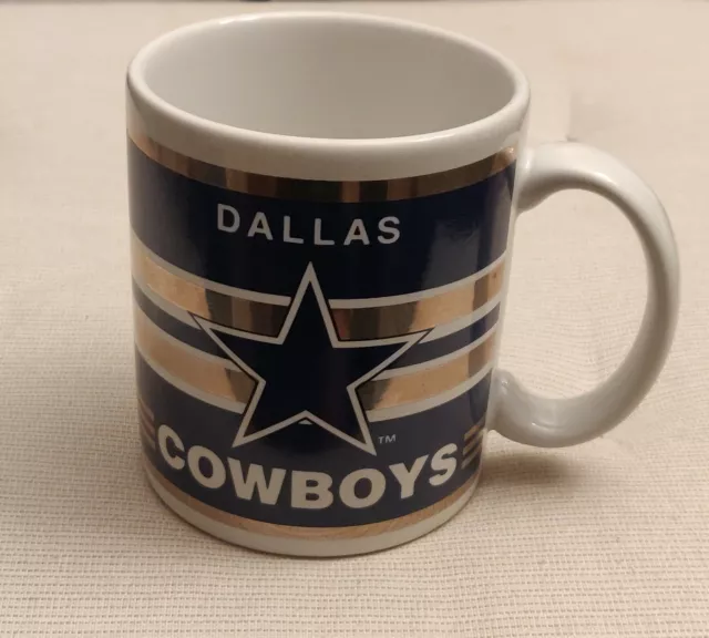 https://www.picclickimg.com/FYMAAOSwb29jI2MR/Vtg-Dallas-Cowboys-12oz-Coffee-Mug-Football-Papel.webp