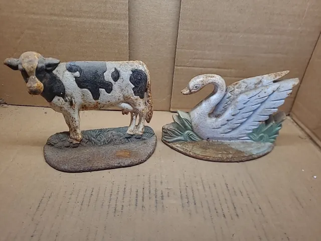 Vintage Lot Of 2 Cast Iron Doorstops Cow Swan
