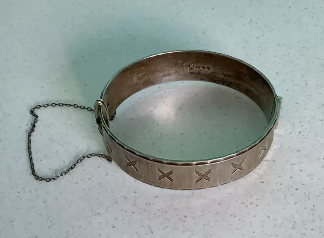 A Vintage Hallmarked Silver Bangle With Safety Chain