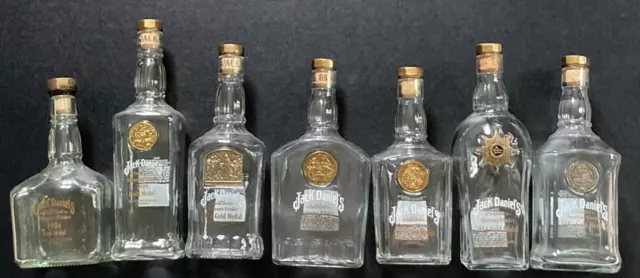 All 7 Jack Daniels GOLD MEDAL bottles 1904/1905/1913/1914/1915/1954/1981 w/corks