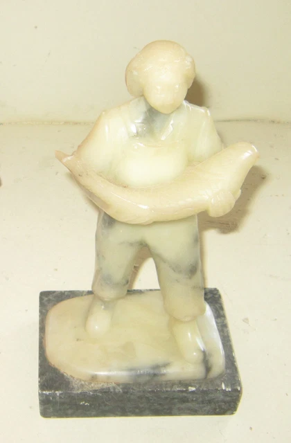 Antique Alaskan Eskimo lavender soapstone carving of a fisherman with salmon