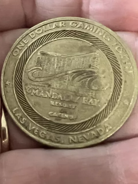 Vintage One Dollar Gaming Token Coin Mandalay Bay Resort Las Vegas NV