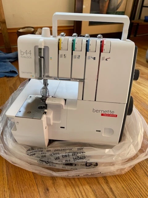 Bernette b44 Funlock by Bernina w/ new w/ tags roller case Bernette b44 Funlock by Bernina w/ new w/ tags roller case