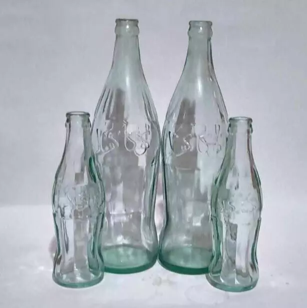 Lot 4 Collection of vintage Coca-Cola bottles of embos arabic writting old clean