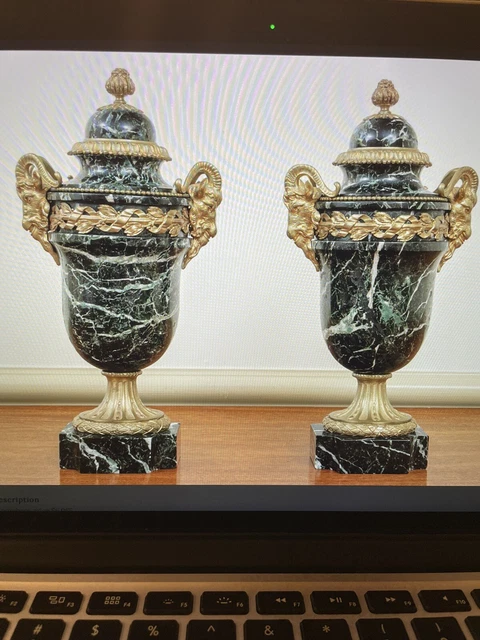 antique pair of French Louis XVI style, dark green marble urns