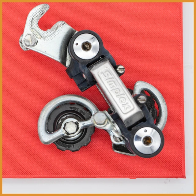 Dérailleur Arrière Vintage SIMPLEX SX410 Pour Peugeot - En Acier Argenté, Occasion En Très Bon état, Fabrication Française | Pièce Cycliste Rétro Pour Vélo De Route
