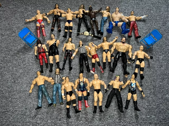 Lot of 23 1990s 2000s WWE/WWF action figures with WWE championship and two chair