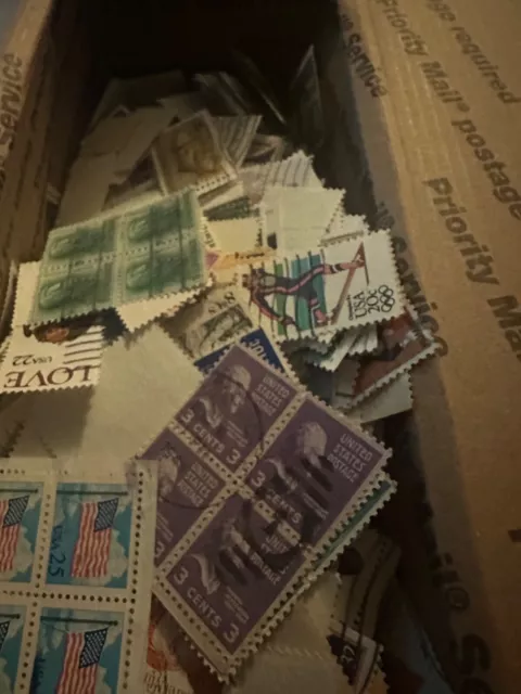 box lot of us stamps off paper thousands of stamps