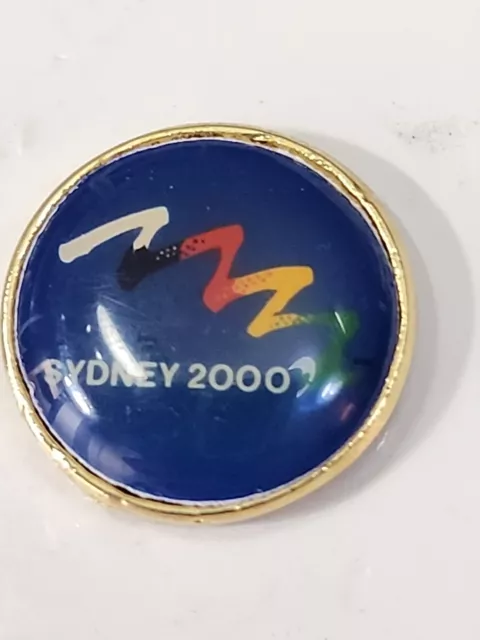 Sydney 2000 Summer Olympic Games Souvenir Lapel Pin Blue Round w/ Squiggle 2