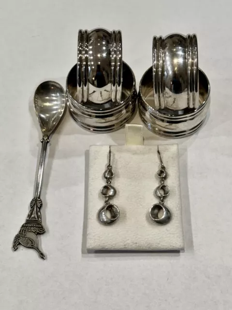 Collection of silver/silver plate items. Earrings, napkin rings and spoon
