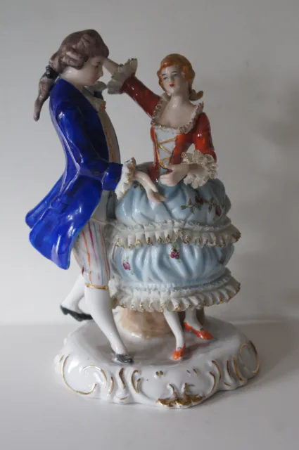 A Lovely Vintage Porcelain Figurine Of A Lady & Man Dancing With Lace Trim.