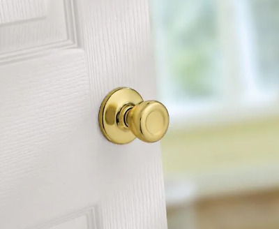 Kwikset Tylo Hall & Closet Polished Brass non locking passage door knob round