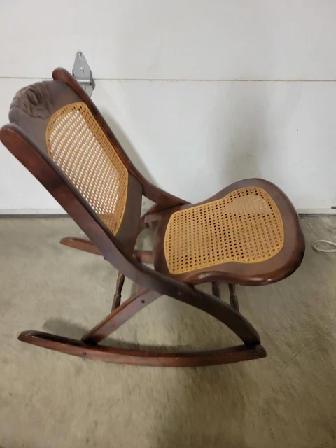 Vintage Folding Wood And Cane Victorian Style Rocking Chair With Floral Carvings Vintage Folding Wood And Cane Victorian Style Rocking Chair With Floral Carvings