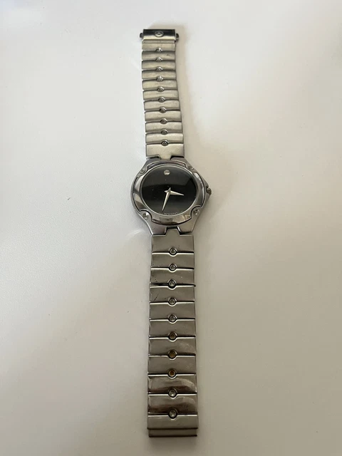 womens Movado Black Dial Gold Accents, 86-A1-816.2 Pre Owned Needs Battery
