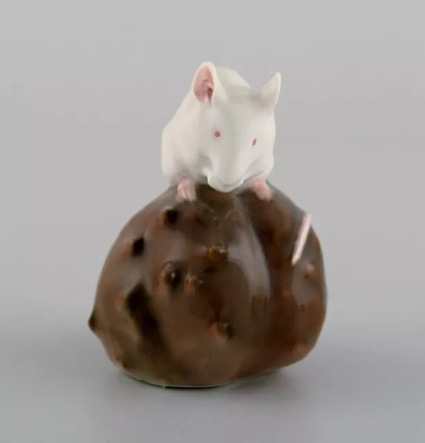 Royal Copenhagen porcelain figurine. Mouse on a chestnut. Early 20th century.