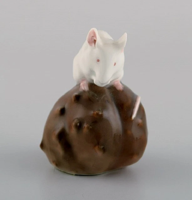 Royal Copenhagen porcelain figurine. Mouse on a chestnut. Early 20th century.