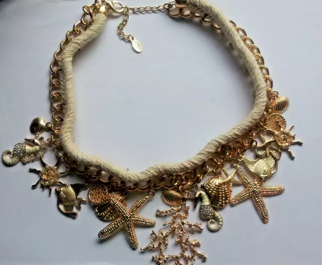 unused Aldo necklace + matching bracelet sea life in gold 