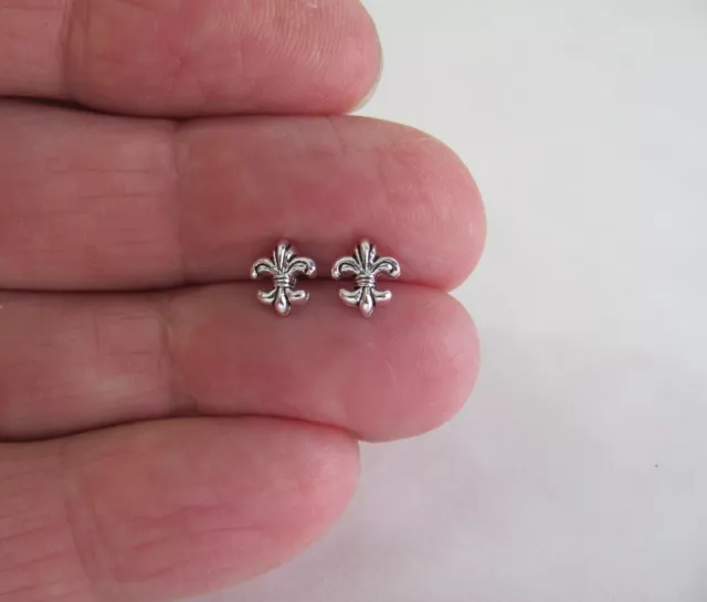 Sterling Silver 7mm tiny Fleur de lis post stud earrings.