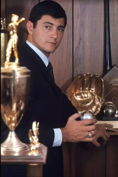 Boston Red Sox Carl Yastrzemski posing with several awards at home - Old Photo