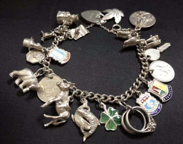 Vintage Sterling Silver Charm Bracelet With 22 Charms. Weight 56g