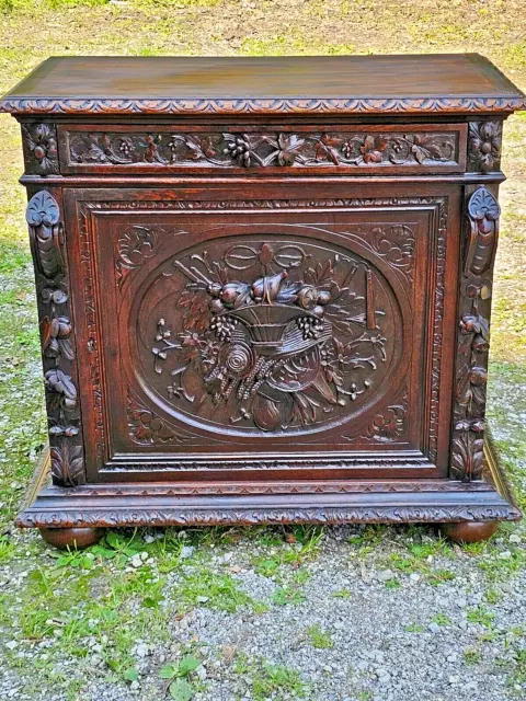 Black forest ornately wood carved oak cabinet