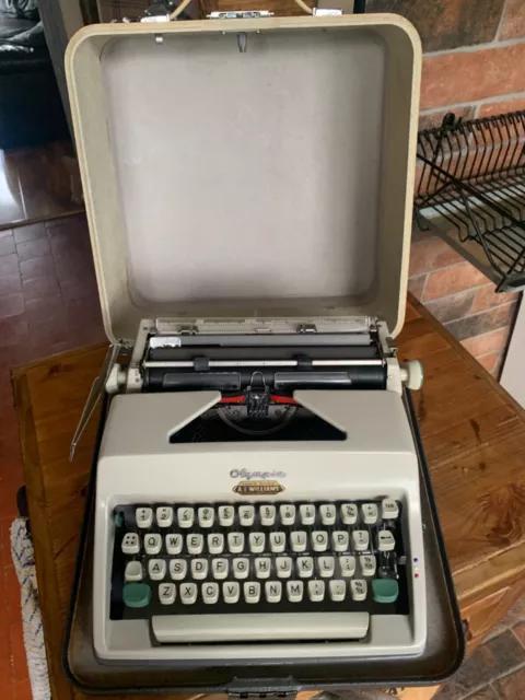 Vintage 1960's Olympia SM8 Portable Typewriter in Case. Full working order.