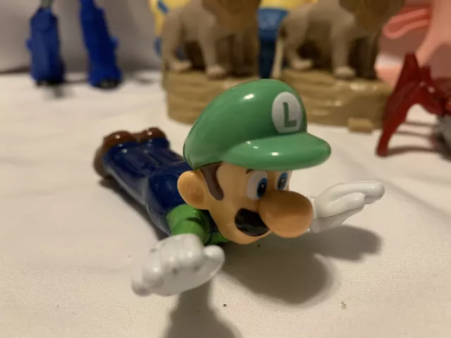 McDonald’s toy lot 8 Toys Luigi ￼ Transformer￼ 2 Lion King 2 Minions￼￼ & Gla