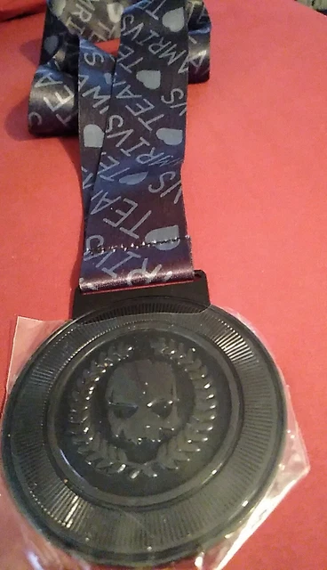 Lanyard Strap Holding A Black Skull With Fathers