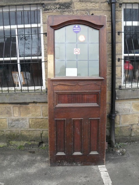 heavy thick antique leaded glass oak entrance door large bold feature oak door