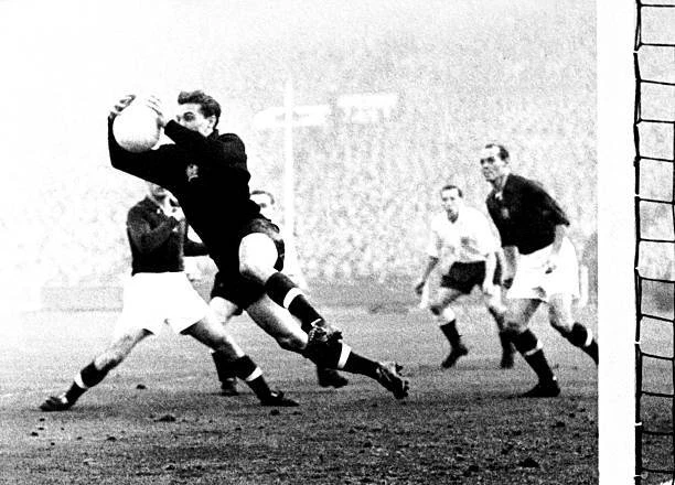 HUNGARY GOALKEEPER GYULA Grosics fields a cross during team 6-3 win Old ...