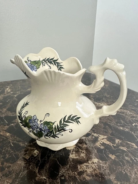 Hand painted ceramic vase in floral blue and green hue