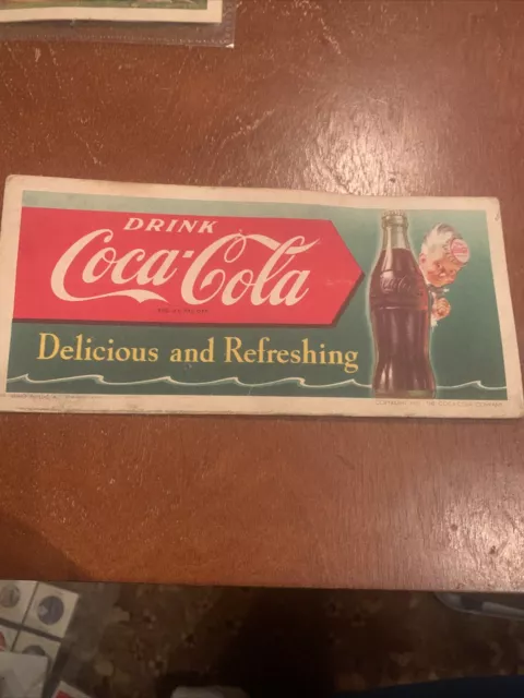 Coca Cola ink blotter with sprite behind bottle in advertising  dated 1951   Y