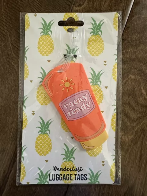 NIP! Wanderlust silicone luggage tag in •Suntan Lotion• shape “vacay ready”