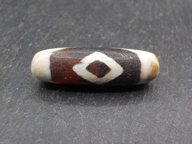 An Agate Dzi bead with a 2 Dragon Eye pattern from Tibet / Nepal.