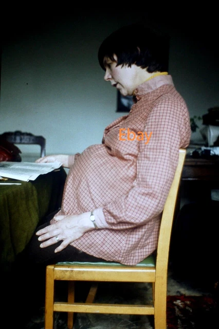35mm Slide, Heavily Pregnant Woman Sitting At Table Reading, Late 1970s