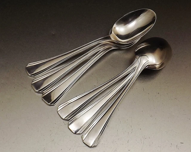 CHRISTOFLE - Douze couverts et douze cuillères à café en métal argenté, la spatule motif Art