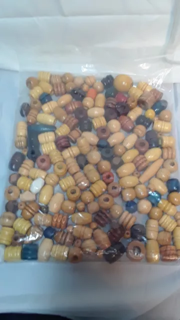 Bag of wooden Beads  different shapes and sizes.