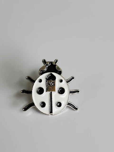 White Lady Bug Lapel Pin With Letters NG