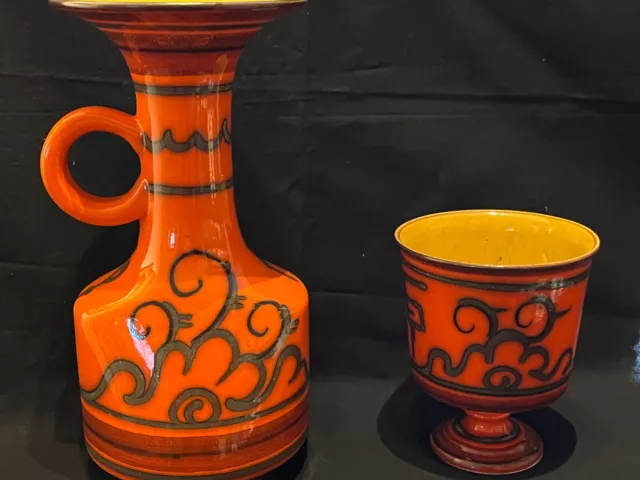 Two GOUDA pottery VASES, red and black, marked bottom
