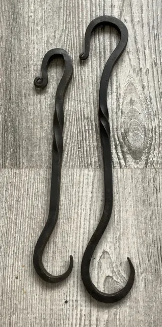 Two Hand forged blacksmith iron sliding hook hangers .