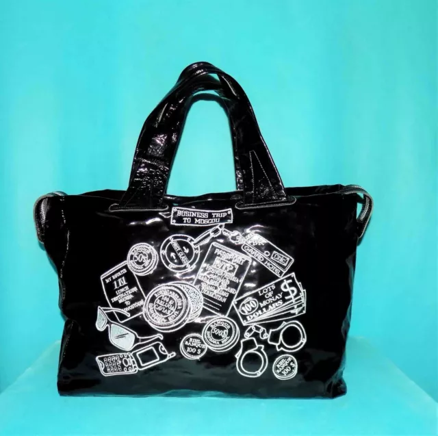 sac de voyage ou week end BARBARA RIHL en cuir et toile noir porté main épaule