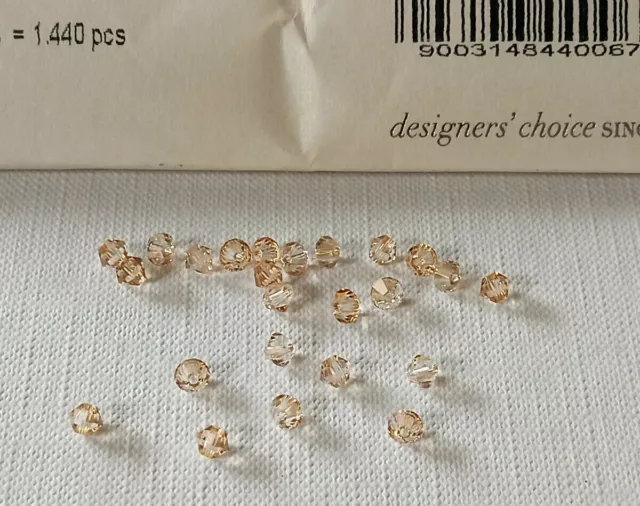 PIETRE CRISTALLO SWAROVSKI ELEMENTS BICONO XILION BEAD ORO TRASPARENTE 4 mm 2