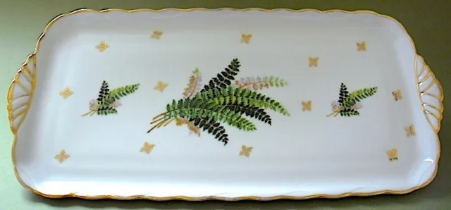 Plat à cake en porcelaine de Paris à décor végétal