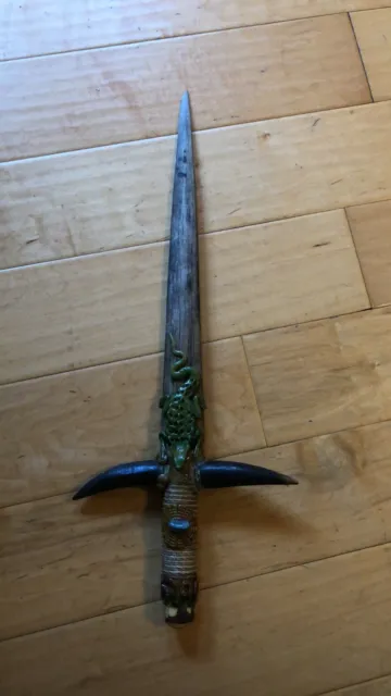 Real bone sword with decorative alligator and horns on two sides  