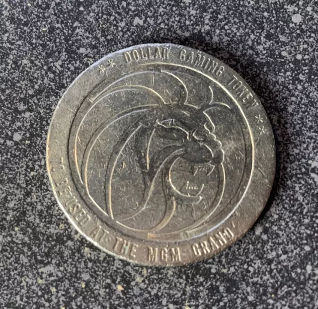 MGM GRAND Casino $1.00 gaming 1984 token / coin Reno, NV Nevada
